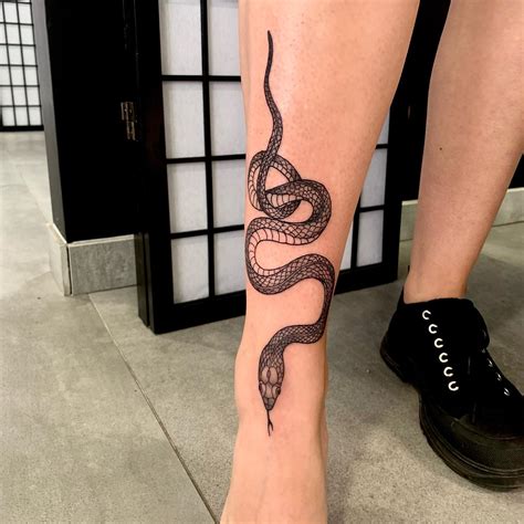 snake leg tattoo meaning